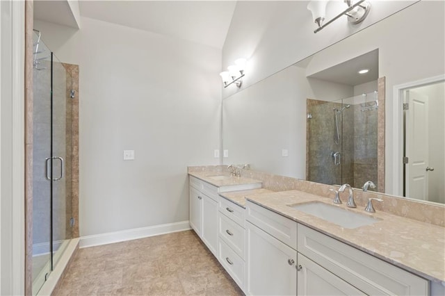 bathroom featuring vanity and a shower with shower door