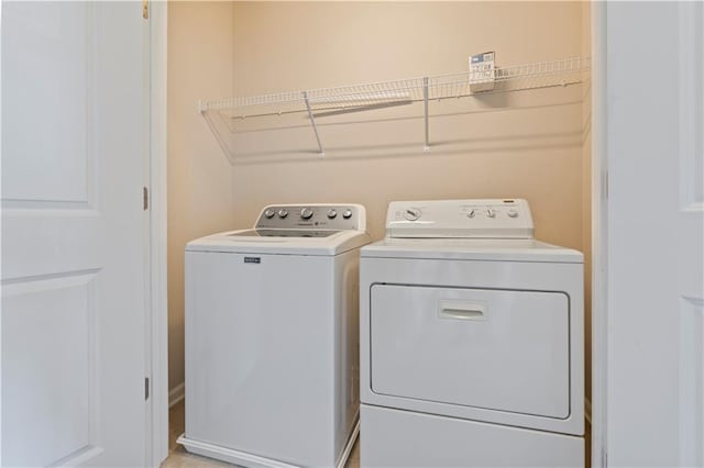 laundry room with washer and clothes dryer