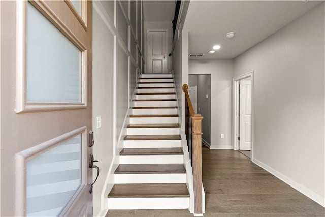 stairs with wood-type flooring