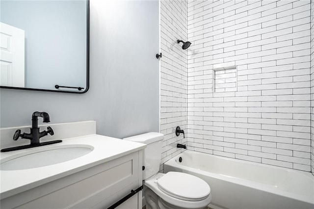 full bathroom with tiled shower / bath combo, toilet, and vanity