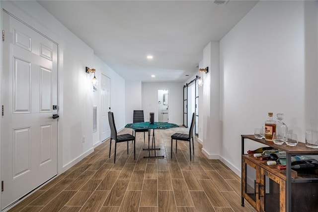 dining space featuring a barn door