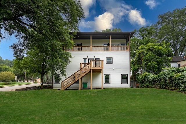 back of house with a lawn