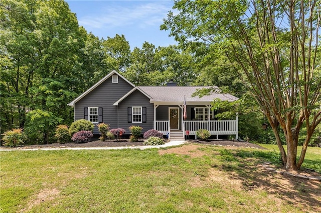 ranch-style home with a front lawn, covered porch, and a chimney