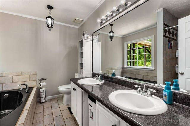 bathroom with a sink, crown molding, tiled bath, and toilet
