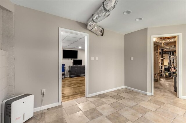 unfurnished dining area featuring baseboards and recessed lighting