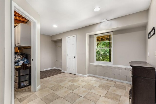 entryway with recessed lighting and baseboards