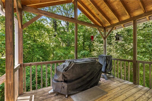 wooden terrace with area for grilling