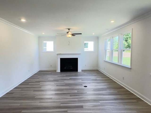 62 Sheryl Way, Loganville, GA 30052 - unfurnished living room featuring ornamental molding, a fireplace, ceiling fan, wood finished floors, and recessed lighting
