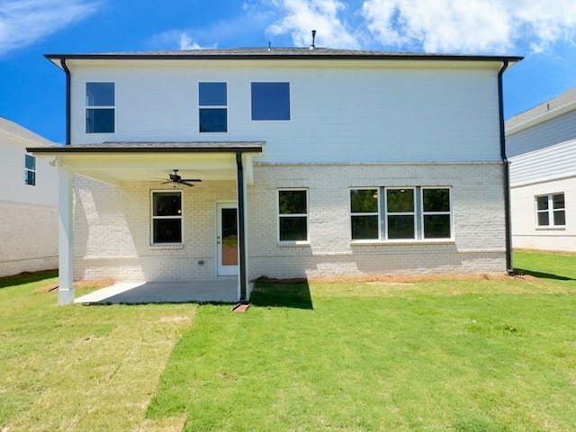 62 Sheryl Way, Loganville, GA 30052 - back of house featuring a patio, brick siding, a ceiling fan, and a lawn