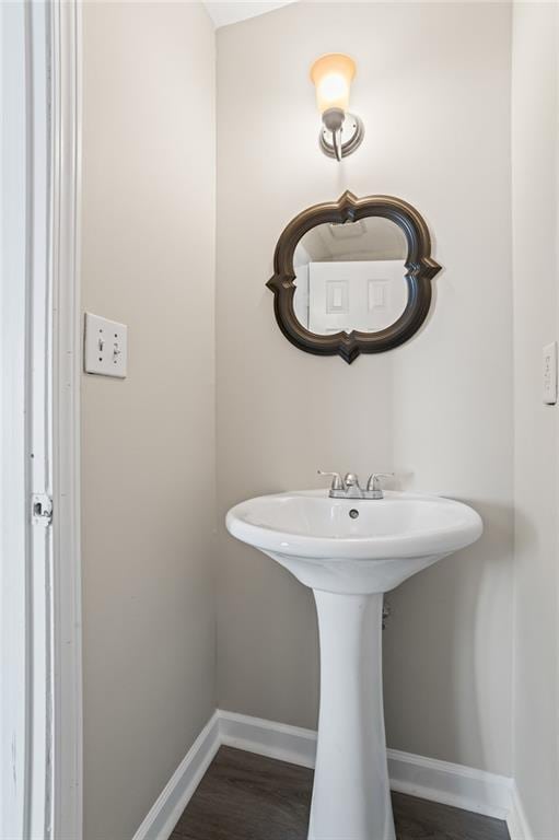 801 Hemingway Rd, Stone Mountain, GA 30088 - bathroom featuring wood finished floors and baseboards