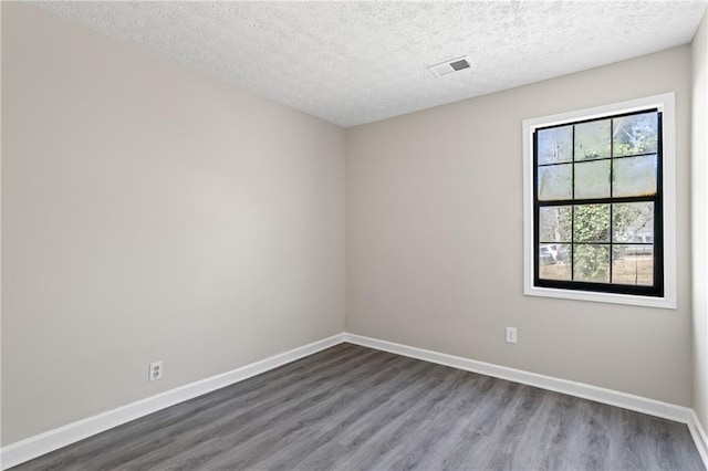 801 Hemingway Rd, Stone Mountain, GA 30088 - unfurnished room featuring visible vents, baseboards, and wood finished floors