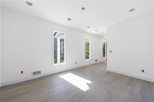 unfurnished room featuring light wood-type flooring