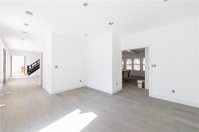 empty room with light hardwood / wood-style floors