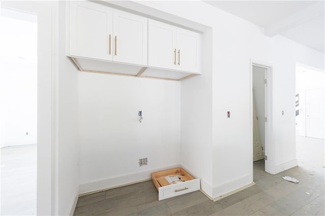 laundry room featuring light hardwood / wood-style floors