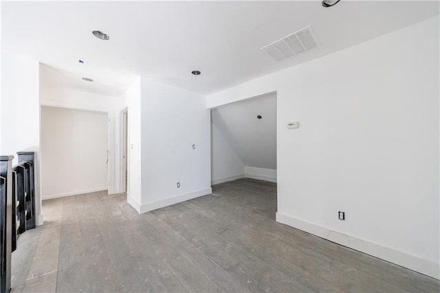 spare room featuring light wood-type flooring