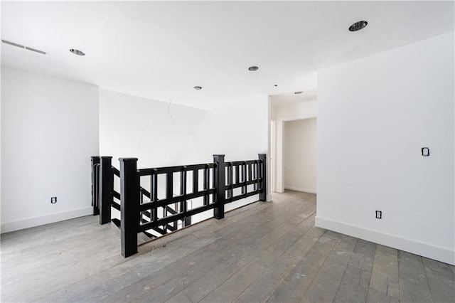 unfurnished room featuring hardwood / wood-style flooring