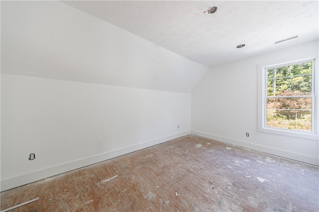 bonus room with vaulted ceiling