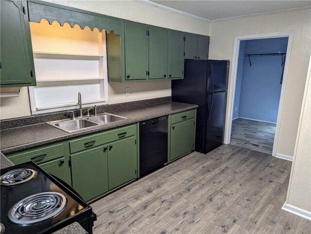 interior space featuring laundry area, electric panel, washer and clothes dryer, wood finished floors, and water heater