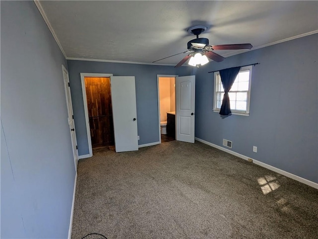 unfurnished bedroom featuring baseboards, carpet floors, visible vents, and crown molding