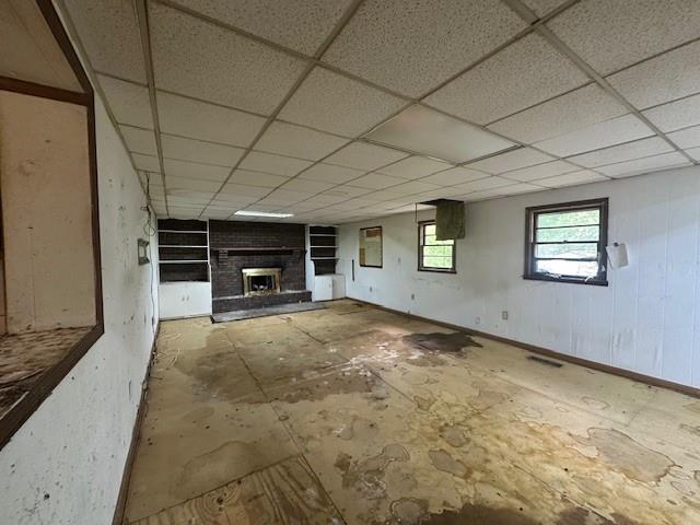 2588 Sandtown Rd SW, Marietta, GA 30060 - unfurnished living room featuring a fireplace and a paneled ceiling