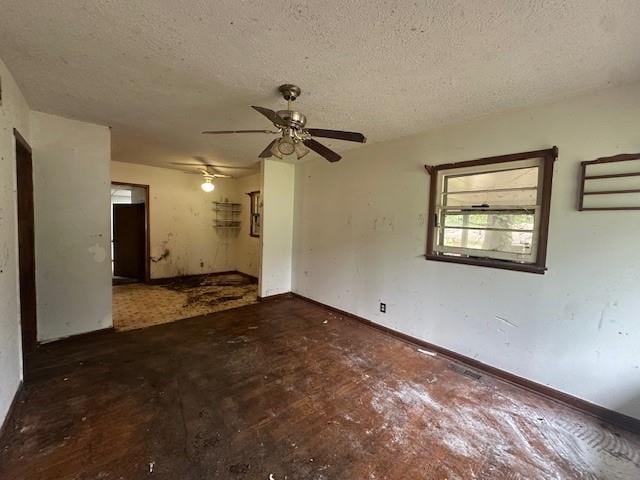 2588 Sandtown Rd SW, Marietta, GA 30060 - empty room featuring a textured ceiling, ceiling fan, and baseboards
