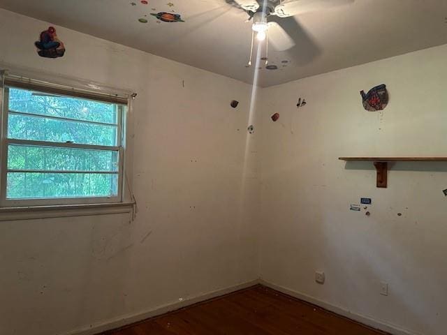 2588 Sandtown Rd SW, Marietta, GA 30060 - empty room featuring wood finished floors, a ceiling fan, and baseboards