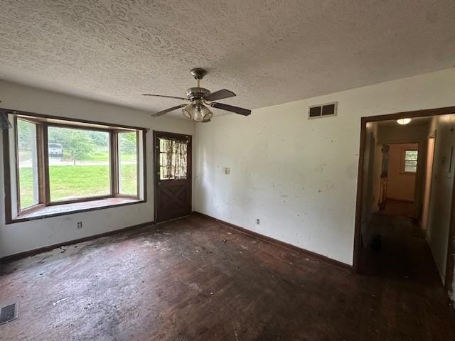 2588 Sandtown Rd SW, Marietta, GA 30060 - foyer with baseboards, plenty of natural light, a textured ceiling, and a ceiling fan