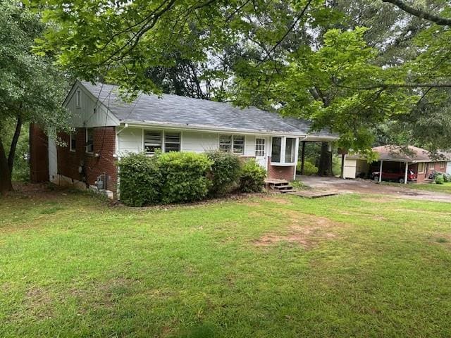 2588 Sandtown Rd SW, Marietta, GA 30060 - rear view of property with a lawn and brick siding