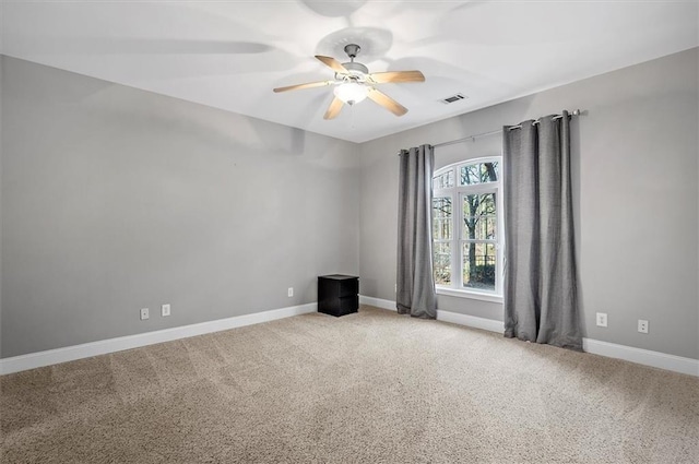 carpeted empty room with ceiling fan