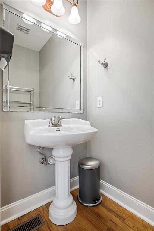 bathroom with hardwood / wood-style flooring