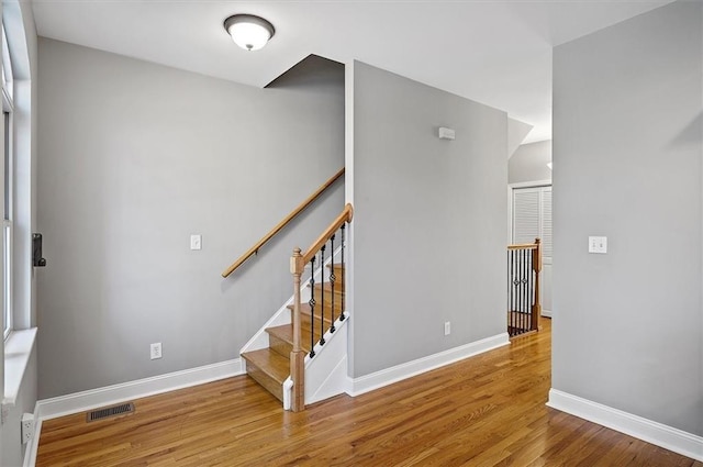 stairway featuring wood-type flooring