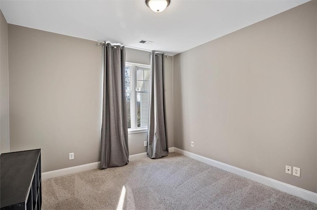 empty room with light colored carpet