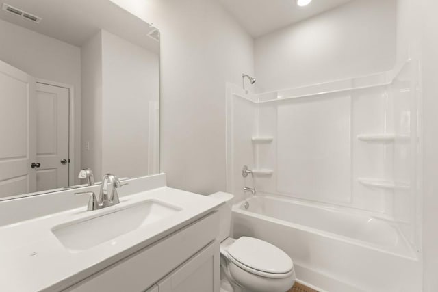 bathroom with washtub / shower combination, visible vents, vanity, and toilet