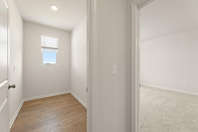 carpeted empty room with baseboards