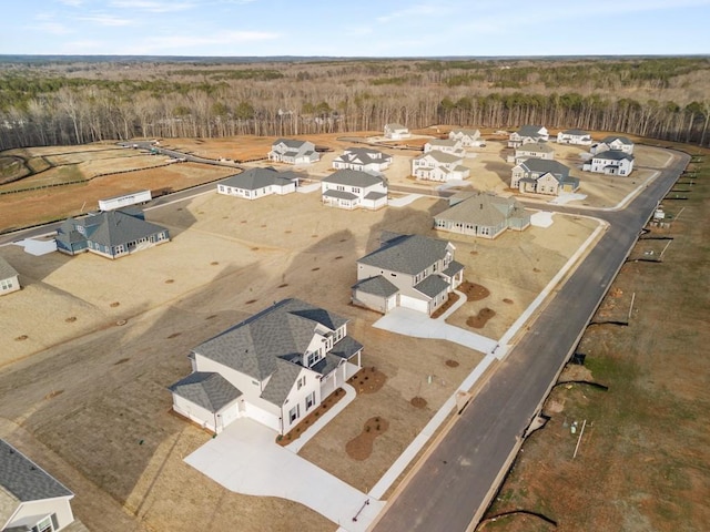 birds eye view of property with a residential view