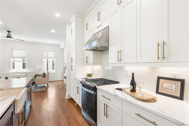 1032 Robert Smalls Way, Atlanta, GA 30318 - kitchen with gas range, under cabinet range hood, white cabinets, open floor plan, and built in microwave