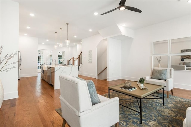 1032 Robert Smalls Way, Atlanta, GA 30318 - living area featuring ceiling fan, baseboards, recessed lighting, stairs, and wood finished floors