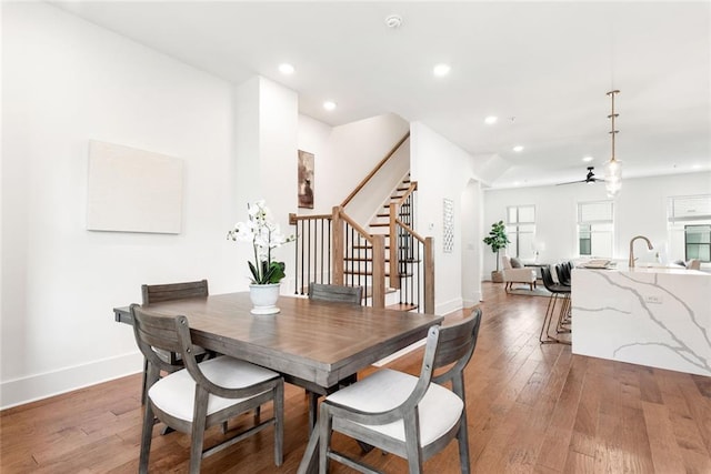 1032 Robert Smalls Way, Atlanta, GA 30318 - dining area featuring stairs, light wood-type flooring, a ceiling fan, baseboards, and recessed lighting