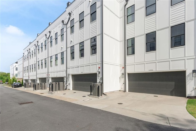 1032 Robert Smalls Way, Atlanta, GA 30318 - view of property featuring an attached garage and concrete driveway