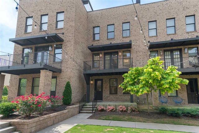 1032 Robert Smalls Way, Atlanta, GA 30318 - townhome / multi-family property with brick siding and a balcony