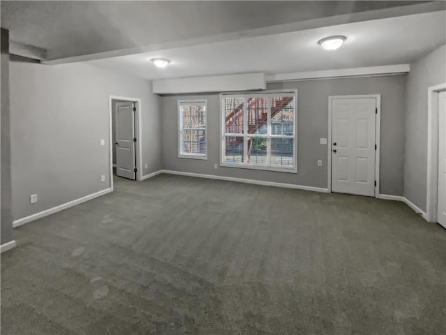 spare room with carpet flooring and baseboards