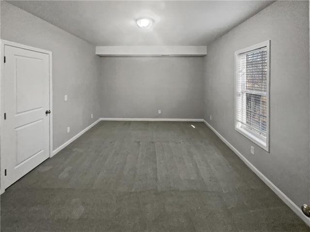 empty room with baseboards