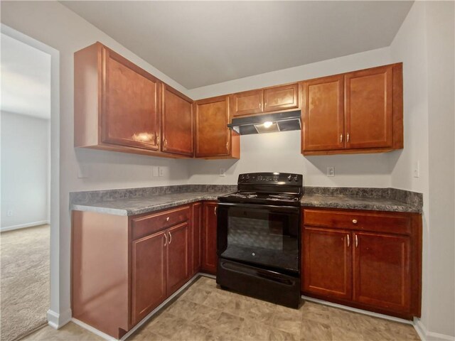 kitchen featuring light carpet and black electric range oven