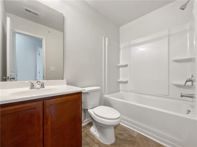 full bathroom featuring toilet, vanity, tile patterned floors, and bathing tub / shower combination