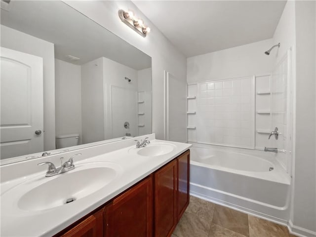 full bathroom featuring toilet, tile patterned floors, bathing tub / shower combination, and vanity