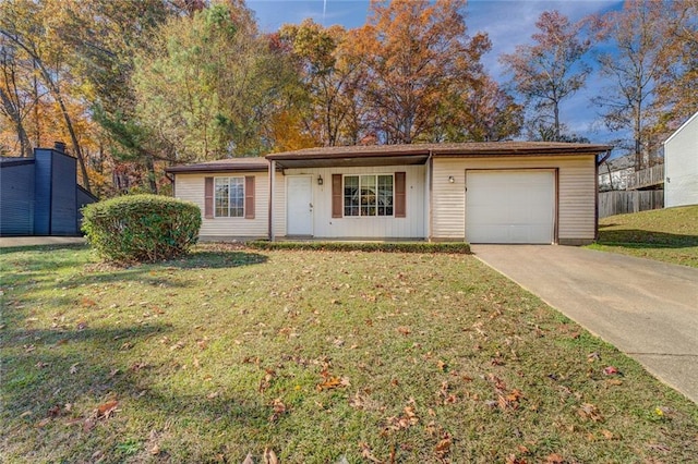 single story home with a front yard and a garage