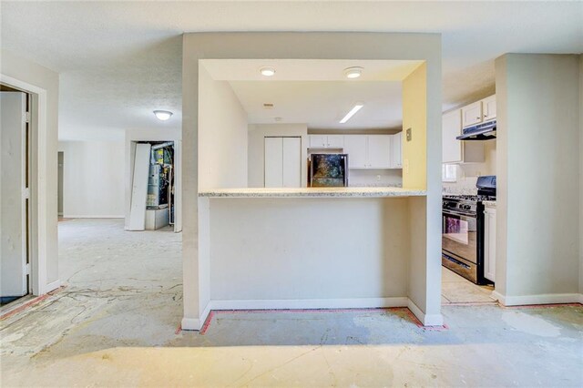 kitchen with white cabinets and black appliances