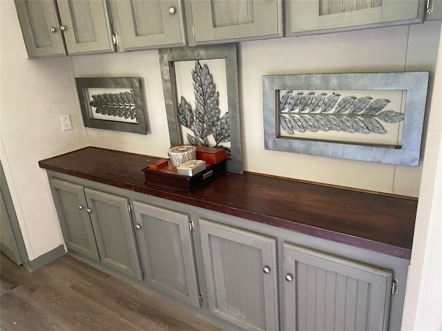 bar featuring dark wood-style flooring