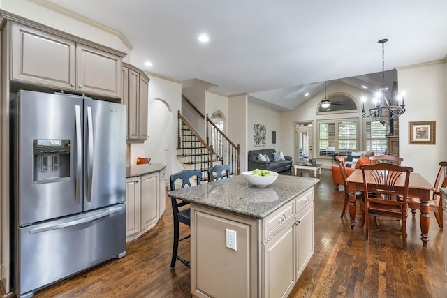 kitchen featuring ceiling fan with notable chandelier, a kitchen island, dark hardwood / wood-style flooring, crown molding, and stainless steel refrigerator with ice dispenser