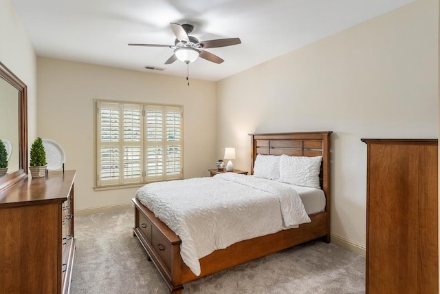 bedroom featuring light carpet and ceiling fan